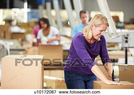 Workers In Warehouse Preparing Goods For Dispatch View Large Photo Image Stock Photo - Workers In Warehouse Preparing Goods For Dispatch. Fotosearch