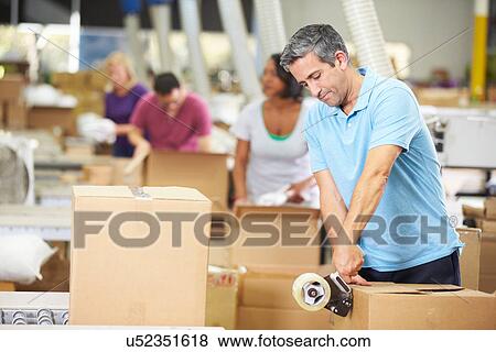 Workers In Warehouse Preparing Goods For Dispatch View Large Photo Image Stock Photo - Workers In Warehouse Preparing Goods For Dispatch. Fotosearch