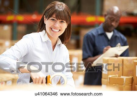 Workers In Warehouse Preparing Goods For Dispatch View Large Photo Image Stock Photograph - Workers In Warehouse Preparing Goods For Dispatch. Fotosearch
