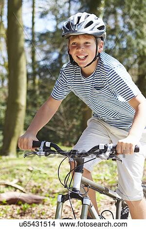 Young Boy Riding Bike Along Country Track View Large Photo Image Picture - Young Boy Riding Bike Along Country Track. Fotosearch