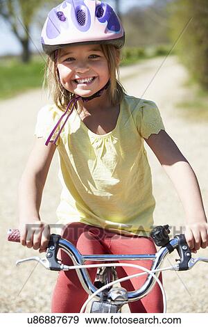 Young Girl Riding Bike Along Country Track View Large Photo Image Stock Photo - Young Girl Riding Bike Along Country Track. Fotosearch