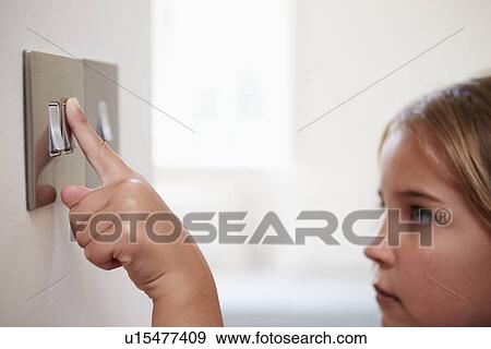 Young Girl Turning Off Light Switch View Large Photo Image Stock Photo - Young Girl Turning Off Light Switch. Fotosearch
