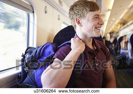 Young Man Relaxing On Train Journey View Large Photo Image Picture - Young Man Relaxing On Train Journey. Fotosearch
