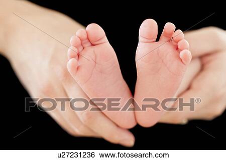 Stock Photograph - Baby's feet. Fotosearch