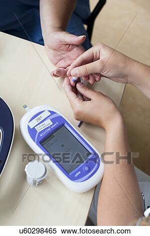 Stock Photography - Blood glucose test. Fotosearch