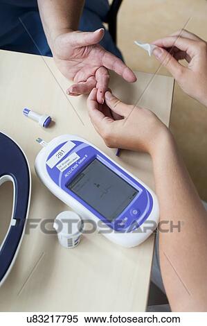 Stock Photography - Blood glucose test. Fotosearch