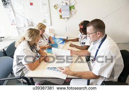 Stock Image - Hospital nursing meeting. Fotosearch