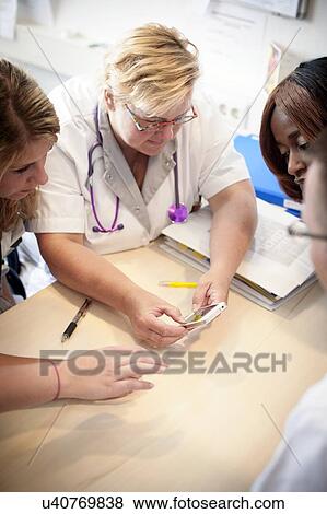 Hospital nursing meeting View Large Photo Image Stock Photo - Hospital nursing meeting. Fotosearch
