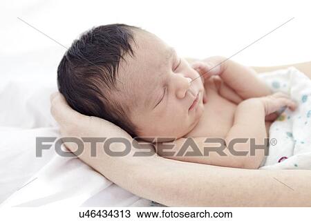 Stock Image - Mother and baby girl. Fotosearch
