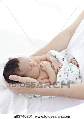 Stock Image - Mother and baby girl. Fotosearch