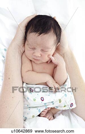 Stock Photo - Mother and baby girl. Fotosearch