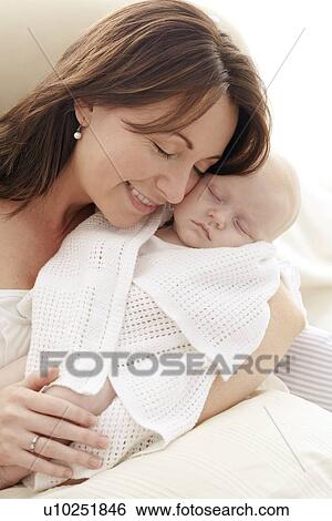 Stock Photograph - Mother and baby. Fotosearch
