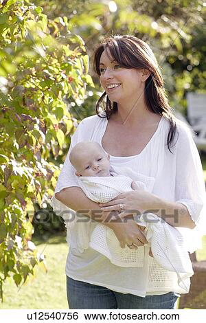 Stock Photograph - Mother and baby. Fotosearch