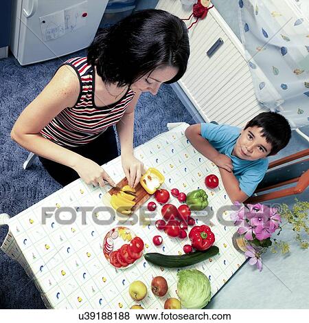 Mother and son preparing vegetables View Large Photo Image Stock Photo - Mother and son preparing vegetables. Fotosearch