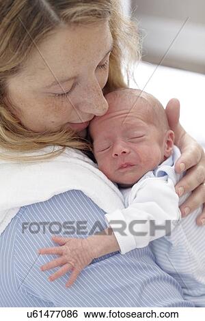 Mother and two week old son View Large Photo Image Stock Photograph - Mother and two week old son. Fotosearch