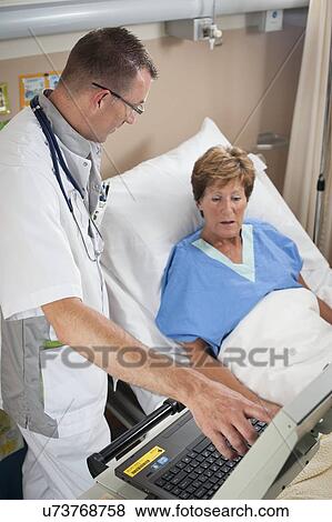 Stock Photo - Nurse and patient. Fotosearch