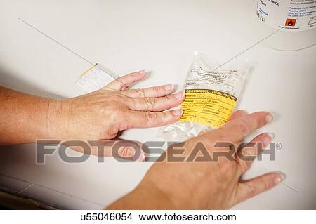 Nurse preparing drugs View Large Photo Image Picture - Nurse preparing drugs. Fotosearch