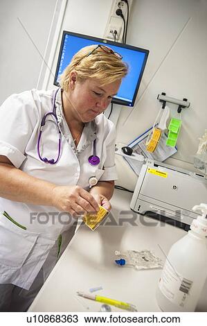 Nurse preparing drugs View Large Photo Image Stock Image - Nurse preparing drugs. Fotosearch
