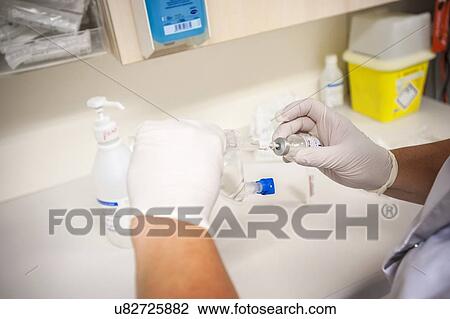 Nurse preparing drugs View Large Photo Image Stock Image - Nurse preparing drugs. Fotosearch