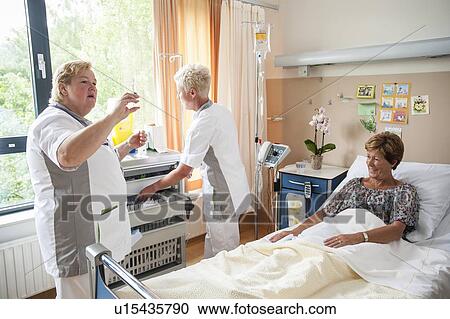 Nurses preparing medication View Large Photo Image Stock Image - Nurses preparing medication. Fotosearch