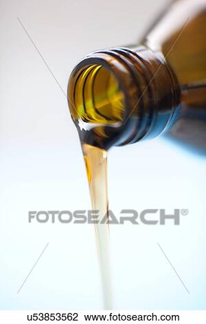 Stock Image - Pouring medicine. Fotosearch