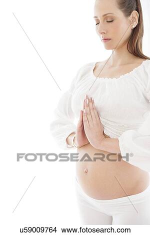 Pregnant woman practicing yoga View Large Photo Image Picture - Pregnant woman practicing yoga. Fotosearch