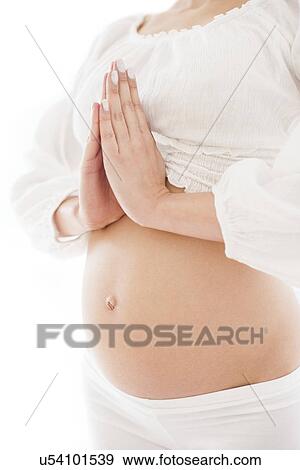 Pregnant woman practicing yoga View Large Photo Image Stock Photo - Pregnant woman practicing yoga. Fotosearch