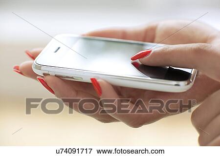 Stock Photo - Smartphone use. Fotosearch