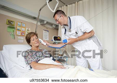 Picture - Taking temperature. Fotosearch