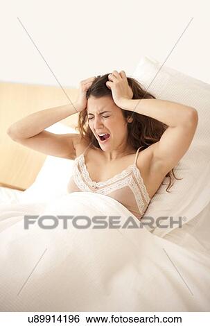 Stock Photograph - Tired woman. Fotosearch