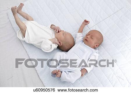 Two week old twins View Large Photo Image Stock Photograph - Two week old twins. Fotosearch