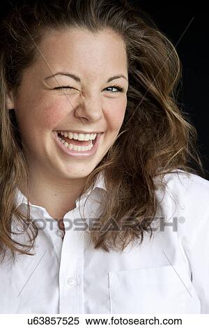 Winking teenage girl View Large Photo Image Stock Photography - Winking teenage girl. Fotosearch