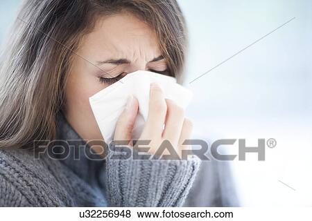 Woman blowing her nose View Large Photo Image Stock Photo - Woman blowing her nose. Fotosearch