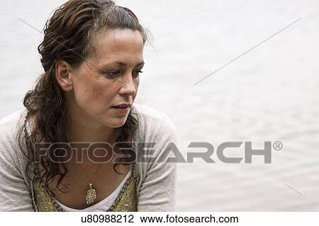 Woman deep in thought View Large Photo Image Stock Image - Woman deep in thought. Fotosearch