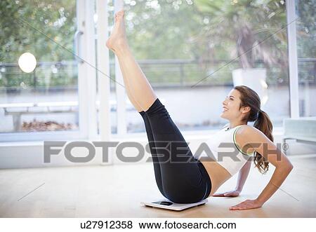 Stock Photo - Woman exercising. Fotosearch
