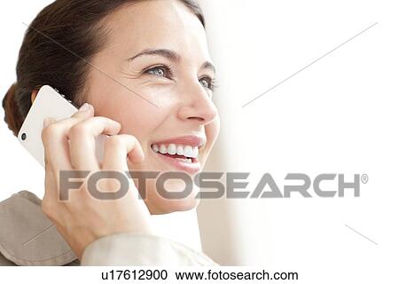Stock Image - Woman on a mobile phone. Fotosearch