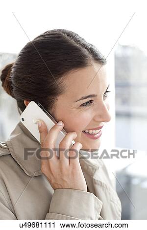 Stock Image - Woman on a mobile phone. Fotosearch