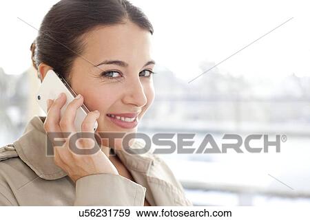 Stock Photo - Woman on a mobile phone. Fotosearch