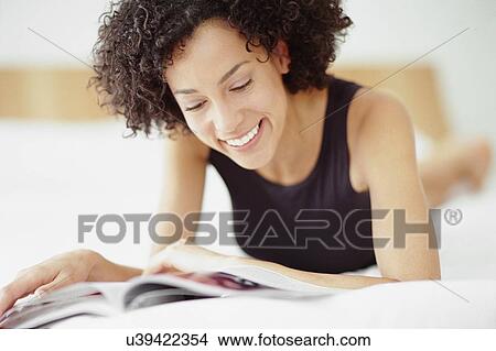 Picture - Woman reading. Fotosearch