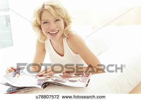 Stock Image - Woman reading. Fotosearch