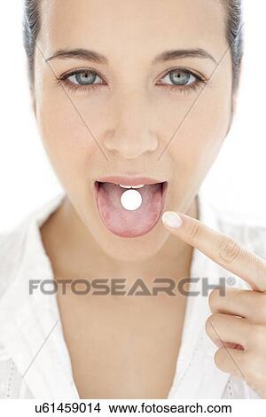 Picture - Woman taking medication. Fotosearch