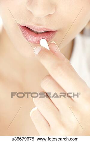 Woman taking medication View Large Photo Image Stock Photography - Woman taking medication. Fotosearch