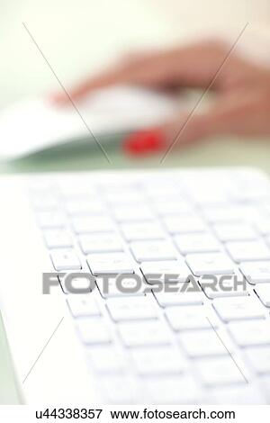 Woman using a mouse View Large Photo Image Stock Photo - Woman using a mouse. Fotosearch