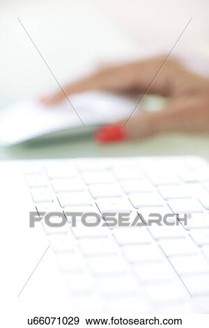 Stock Photo - Woman using a mouse. Fotosearch