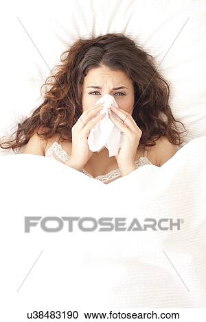 Stock Image - Woman with a cold. Fotosearch