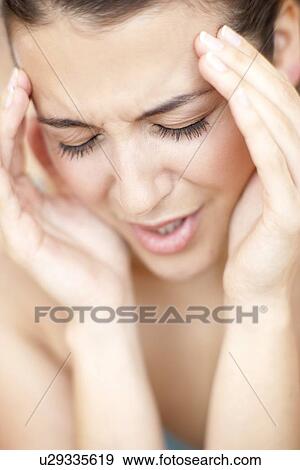 Stock Photo - Woman with a headache. Fotosearch