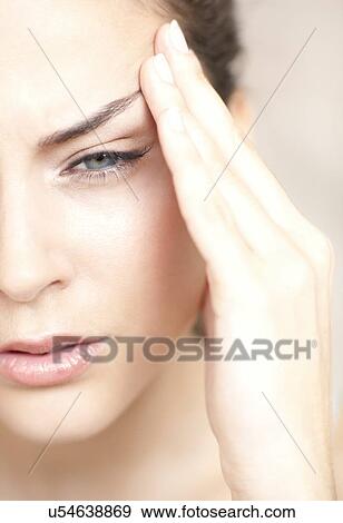 Woman with a headache View Large Photo Image Stock Photo - Woman with a headache. Fotosearch
