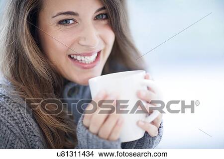 Picture - Woman with hot drink. Fotosearch