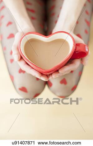 Woman with hot drink View Large Photo Image Stock Image - Woman with hot drink. Fotosearch