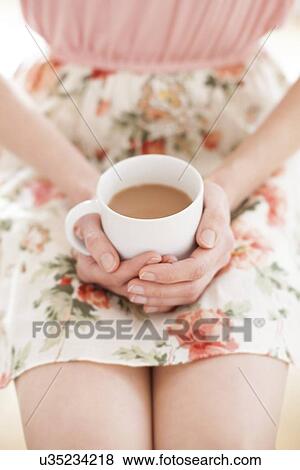 Woman with hot drink View Large Photo Image Stock Photo - Woman with hot drink. Fotosearch